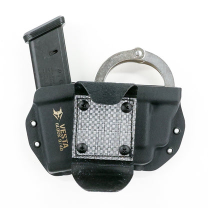 Vesta handcuff and magazine carrier with Squeeze XL belt attachment – open position