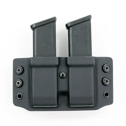 Wyvern Kydex carrier holding two Glock 9 mm/.40 S&W magazines – front view