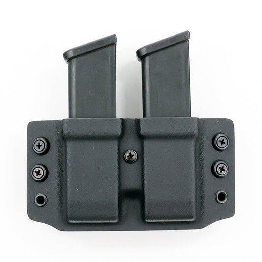 Wyvern Kydex carrier holding two Glock 9 mm/.40 S&W magazines – front view
