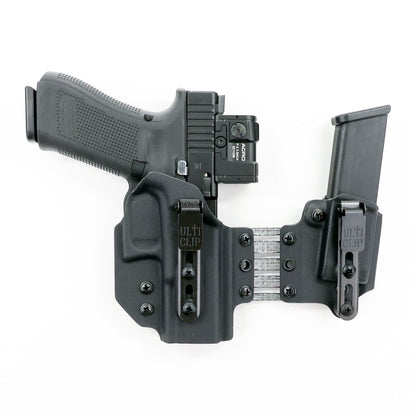 Front view of the Shadow appendix holster system showing dual UltiClip Slim 3.3 clips, adjustable Tegris bridge and spare magazine